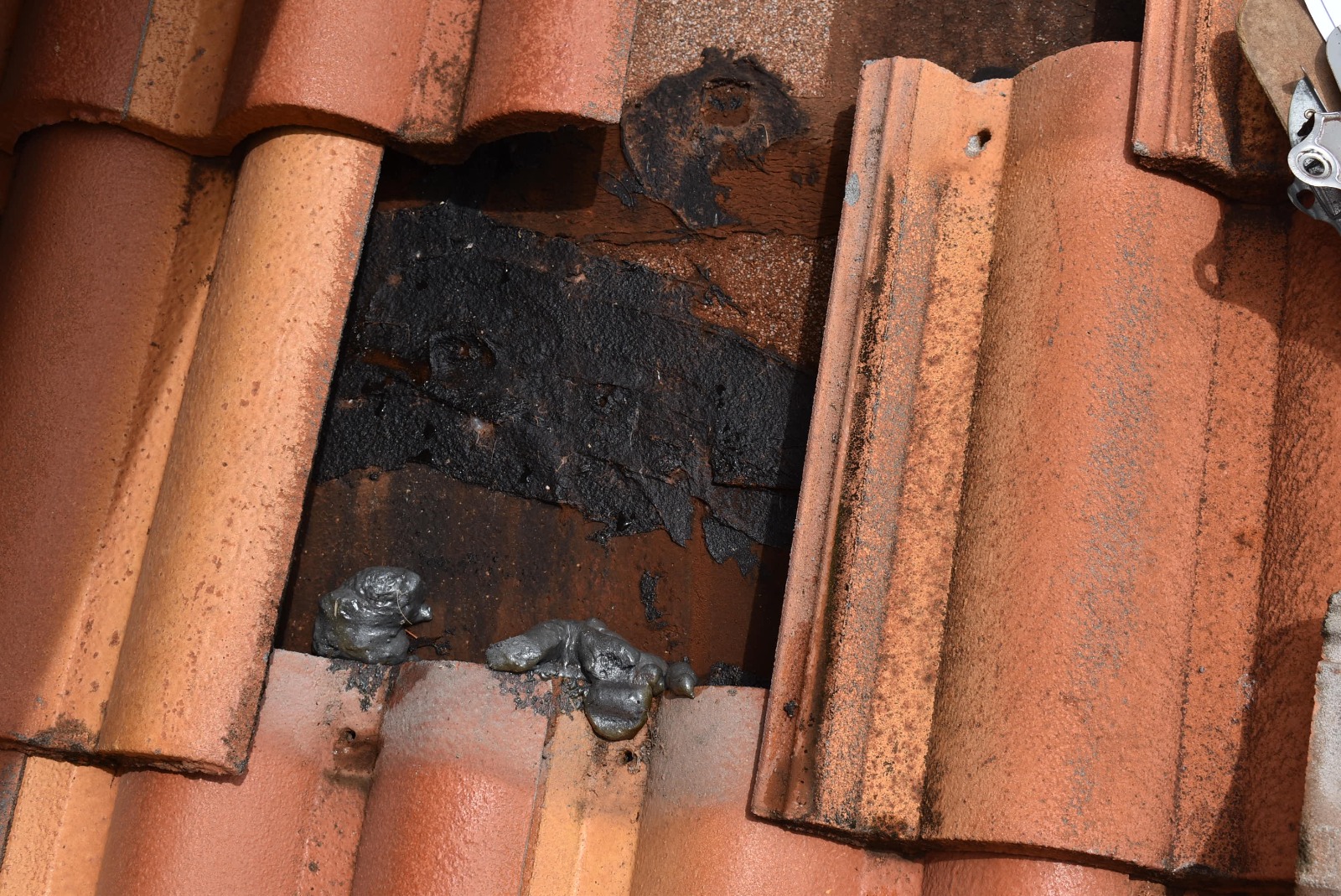 missing concrete tile. damaged roof underlayment